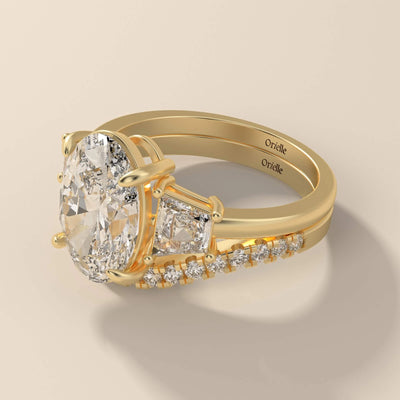 round diamond band matching oval engagement ring in yellow gold
