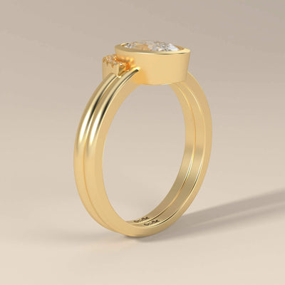 Bezel Set Oval Engagement Ring Paired with Round Moissanite Band
