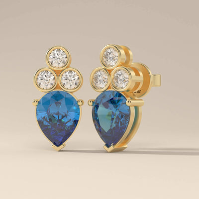 Handmade blue sapphire earrings with pear cut and moissanite
