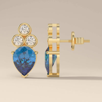 Unique design blue sapphire earrings with bezel set pear stones
