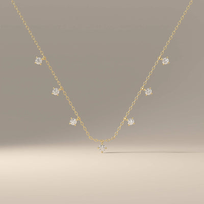 Dainty chain pendant with seven round moissanite gems
