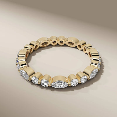 Handmade marquise and round eternity band with bezel set details
