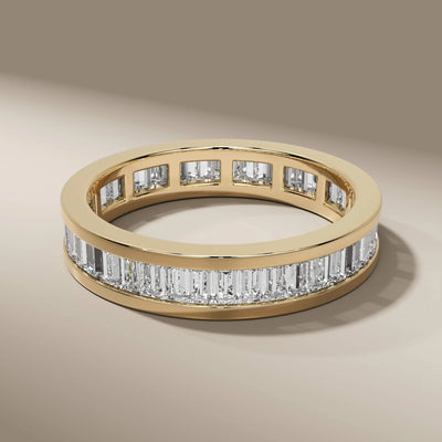 yellow gold band featuring full eternity baguette diamonds

