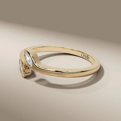 bezel set marquise cut wedding band in sleek yellow gold
