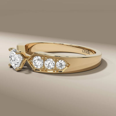 side stone ring with round cut diamond and yellow gold band
