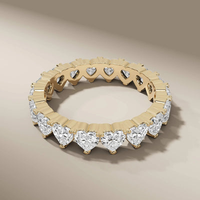 eternity wedding band with heart motifs in prong setting
