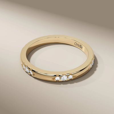 Handmade round cut wedding band with sleek unique setting
