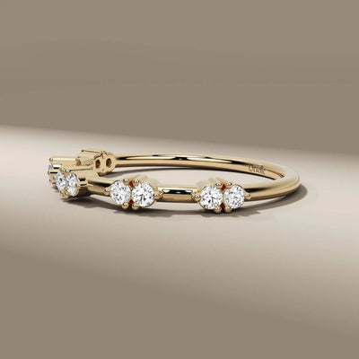 eternity wedding band in yellow gold with round cut lab diamonds
