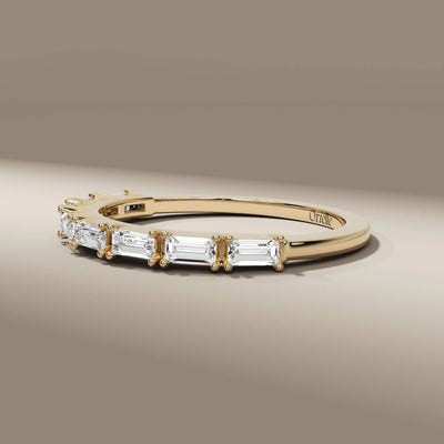 prong set baguette cut east west diamond wedding band
