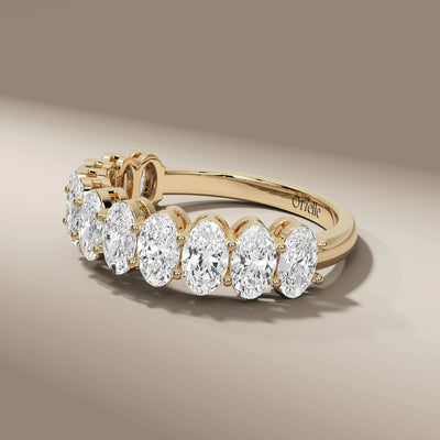 designer oval diamond wedding band with shared prongs

