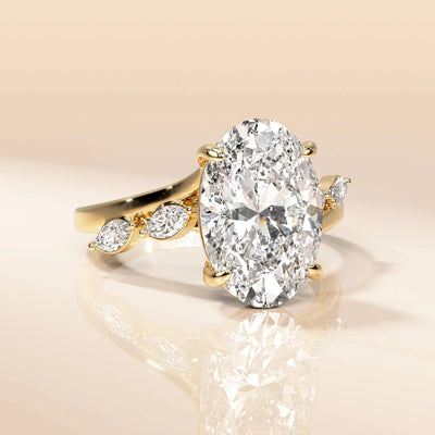 Yellow gold oval engagement ring with marquise side stones
