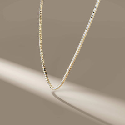 round diamond tennis necklace in polished yellow gold
