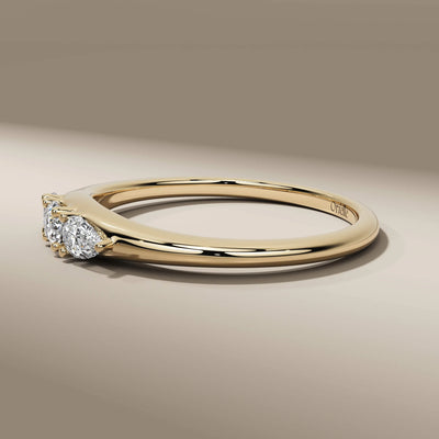 pear cut engagement ring with prong setting and lab grown diamonds
