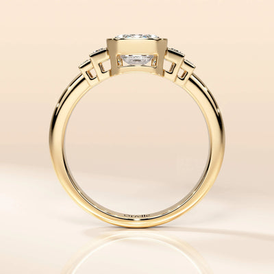Yellow gold engagement ring featuring side baguette stones
