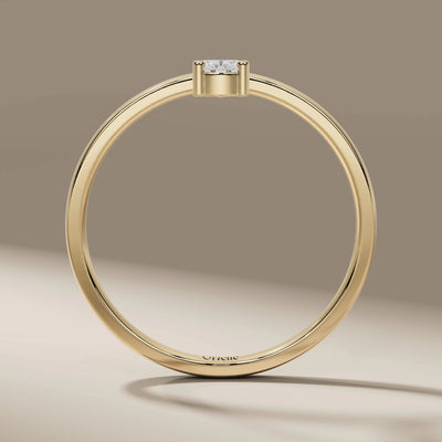 yellow gold pear cut engagement ring in solitaire setting
