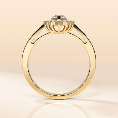 Round cut halo engagement ring in yellow gold

