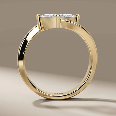 yellow gold engagement ring featuring marquise cut diamond
