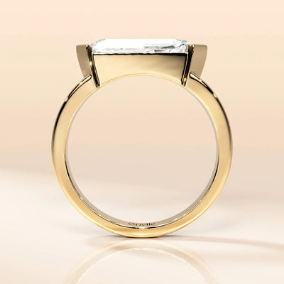 Half bezel setting engagement ring crafted in gold
