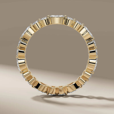 Designer wedding band with marquise diamonds in shared prong style

