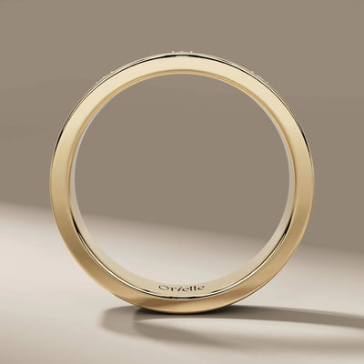 handmade flush set wedding band in polished yellow gold
