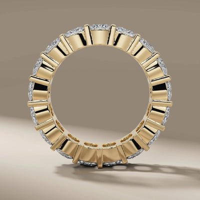 cushion cut shared prong eternity wedding band yellow gold
